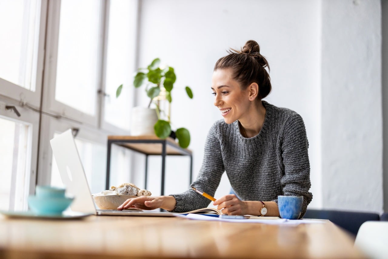 Marketing manager smiling at desk